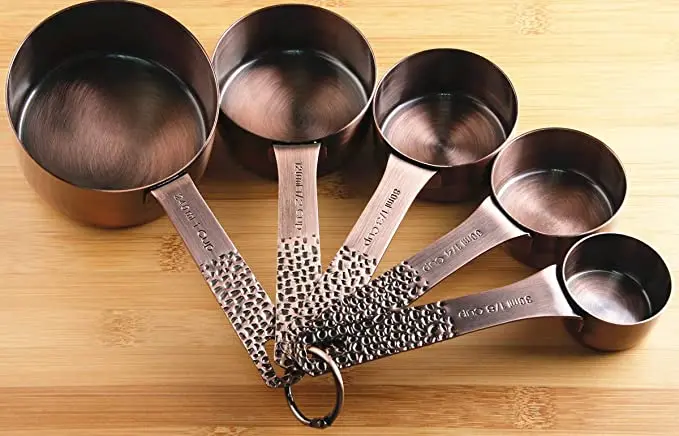  Set of 11 copper-plated stainless steel measuring cups and spoons 5 6 colored