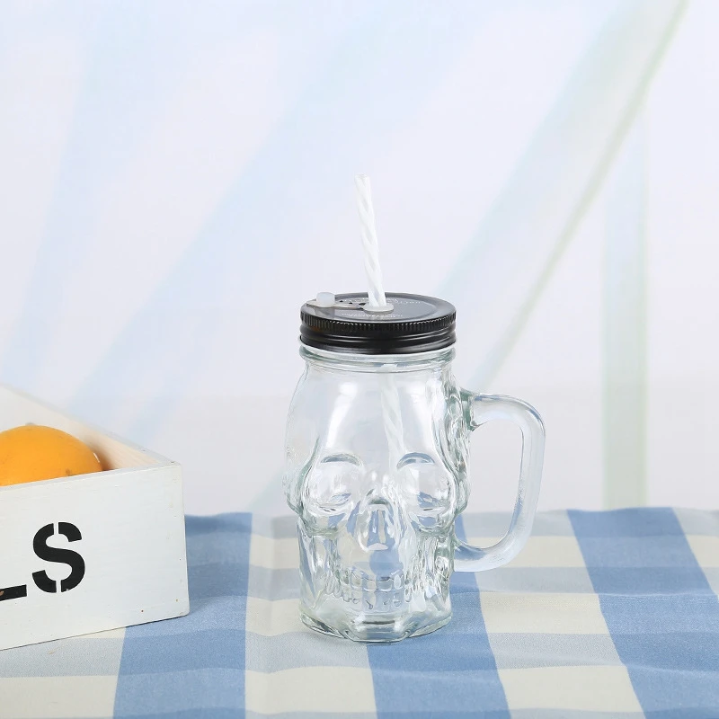 Custom Color Food Grade Skull Shape Wide Mouth Glass Mason Jar with Lids Straw Handle for Beverage Juice Container
