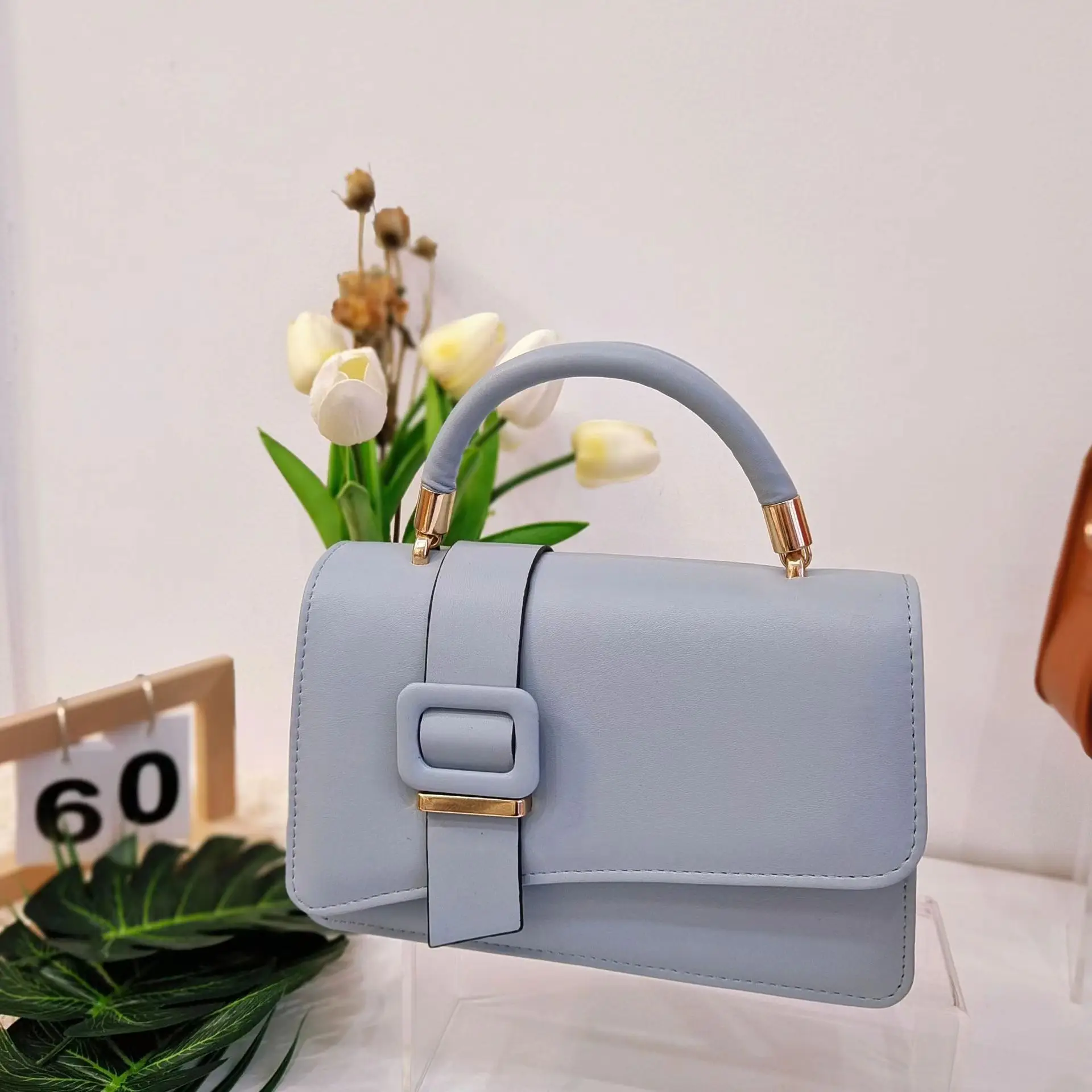 2024 ladies new popular handbag wrist portable slung ladies handbag.