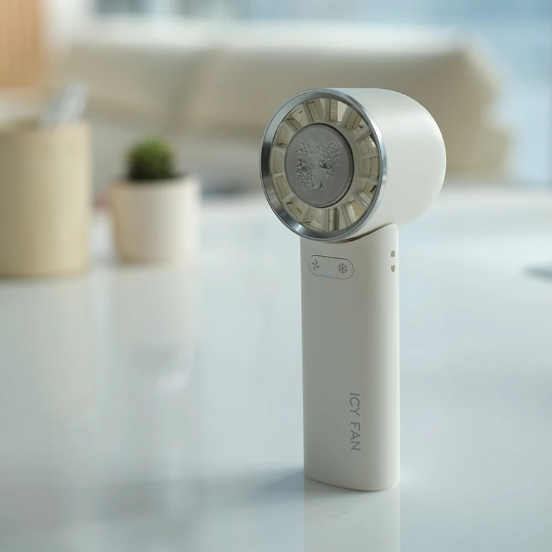 2024 New Design Rechargeable Handy Refrigeration Cold Cooling Ice Compress Fan Rechargeable Mini Portable Handheld Fan