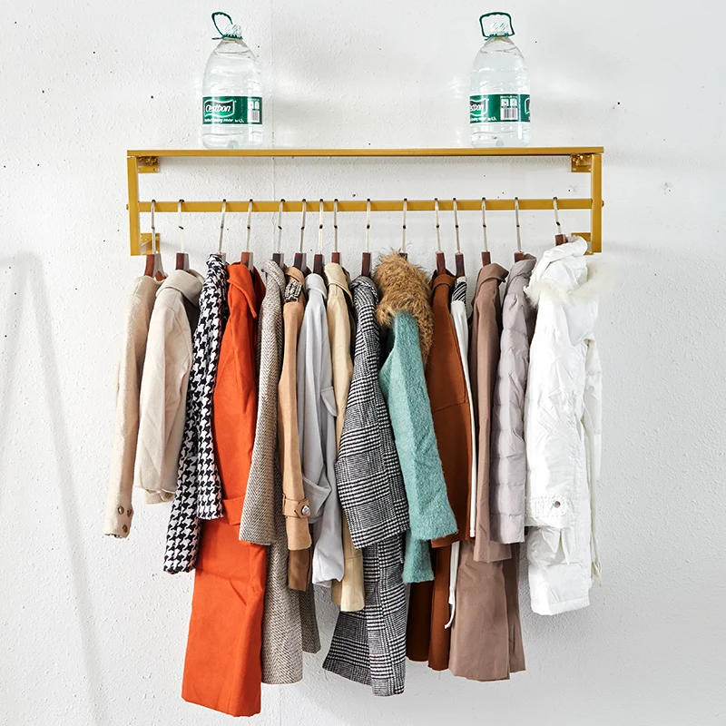 clothes shop display rack wall-mounted clothing rack decorative metal garment rack with storage shelf