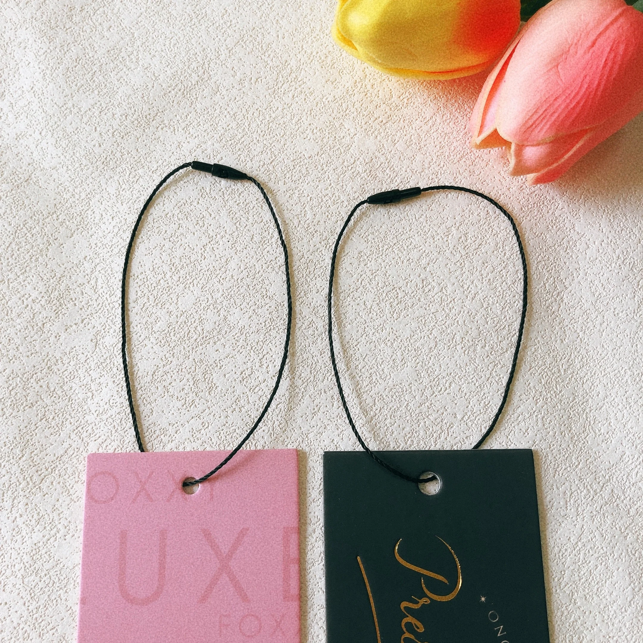 Clothing accessory polyester biodegradable hangtag BulletHead black string knotting