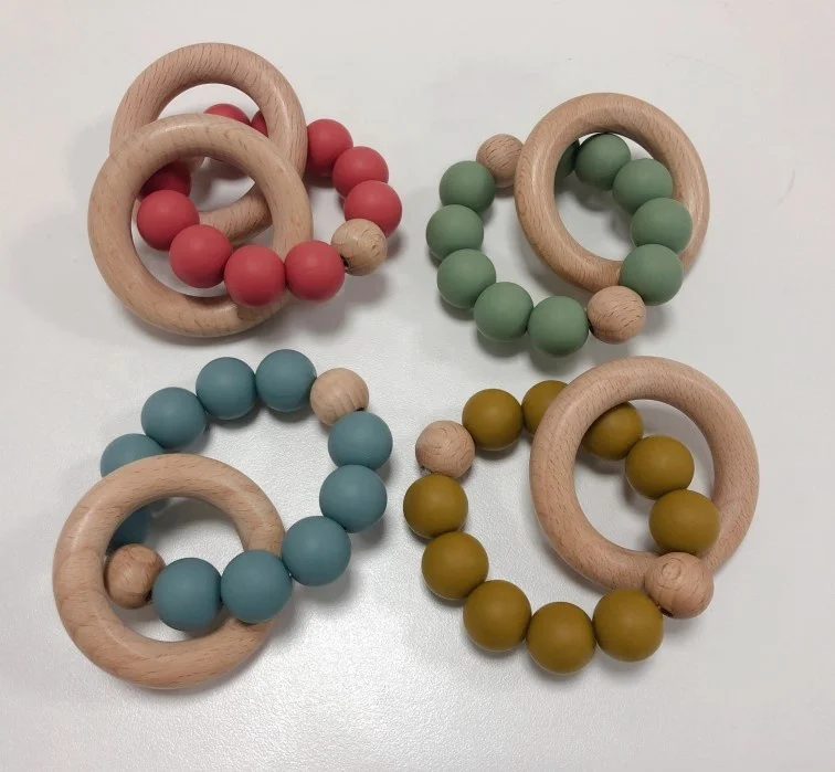 
Wholesale Logo Custom Non-Toxic Wooden Teething Toy Silicone dot speckled Beads Baby Teether Wooden Infant Teething Ring Toys 