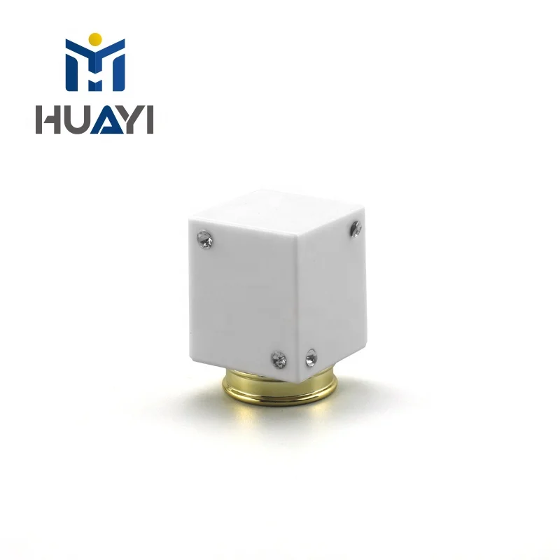 Black and white plastic cap for perfume bottle cover