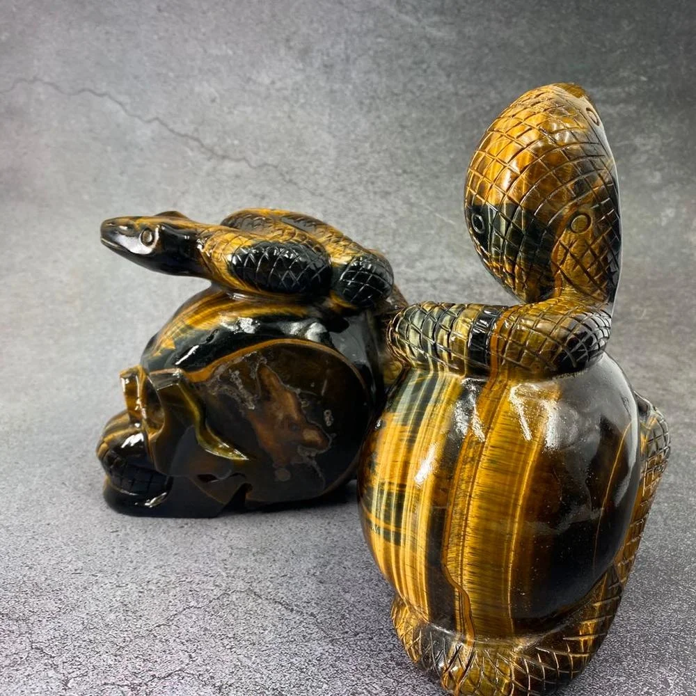 Customized product hand carved crystal skull with snake art sculpture folk crafts tiger eye skull for decoration