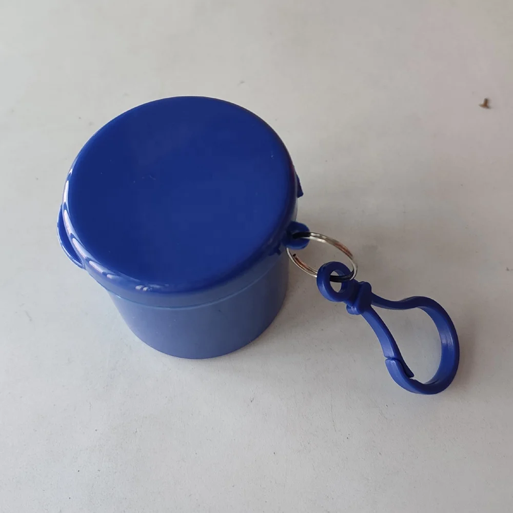 
disposable raincoat in a plastic round box 