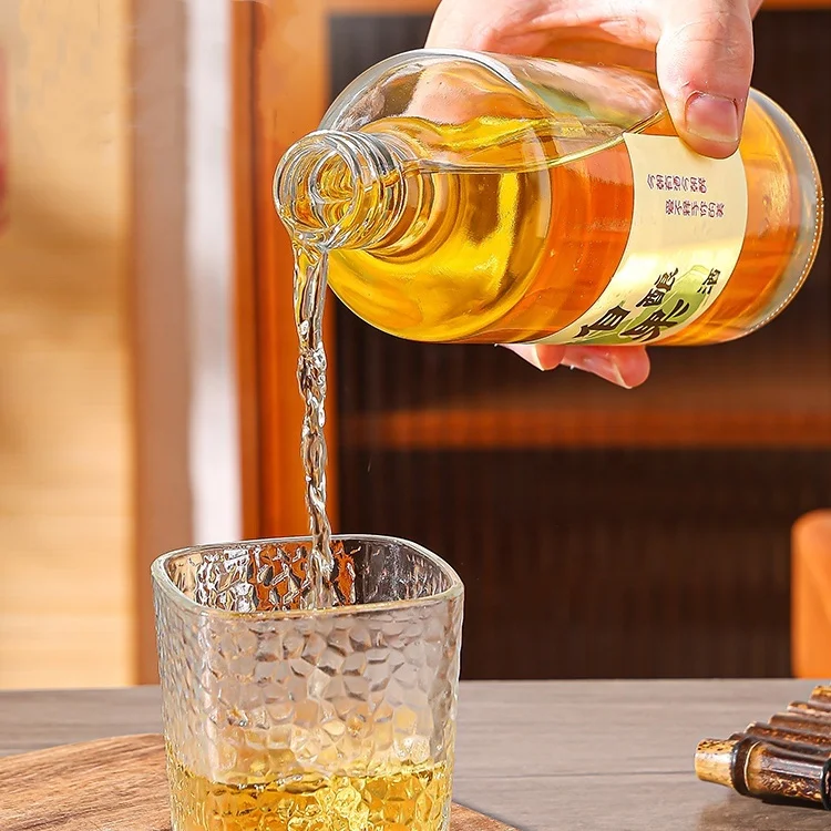 Top-ranking Products 500ml 700ml Transparent Round Glass Liquor Wine Vodka Tequila Bottle With Sealed Cork