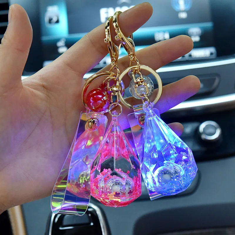 Creative LED Flashlight  acrylic water drop key chain Symphony leather rope key chain into the oil quicksand pendant