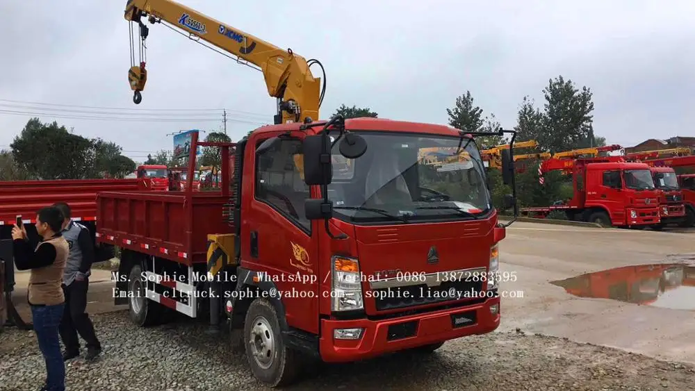 sinotruck RHD howo dump truck with crane 6 wheel dump truck load volume capacity for sale in dubai