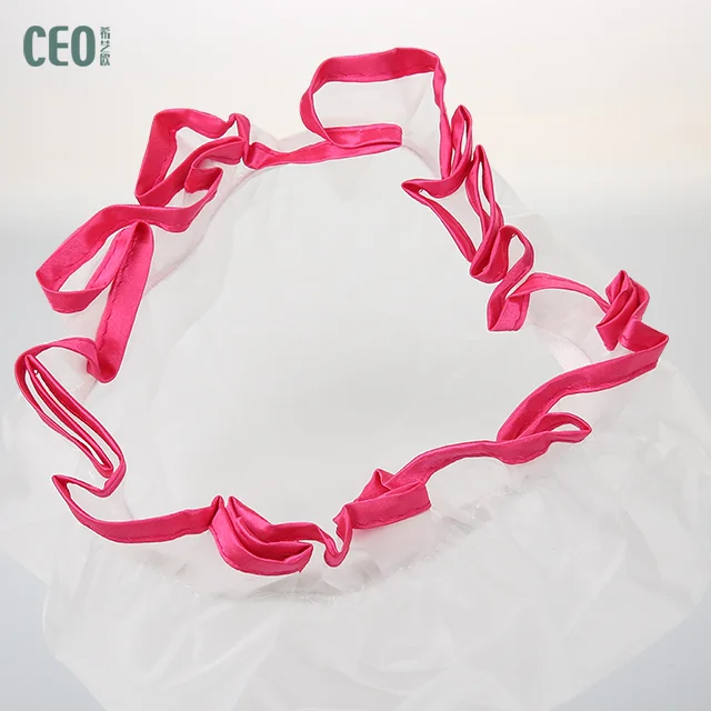 White oversize disposable shower cap with blue and red brim