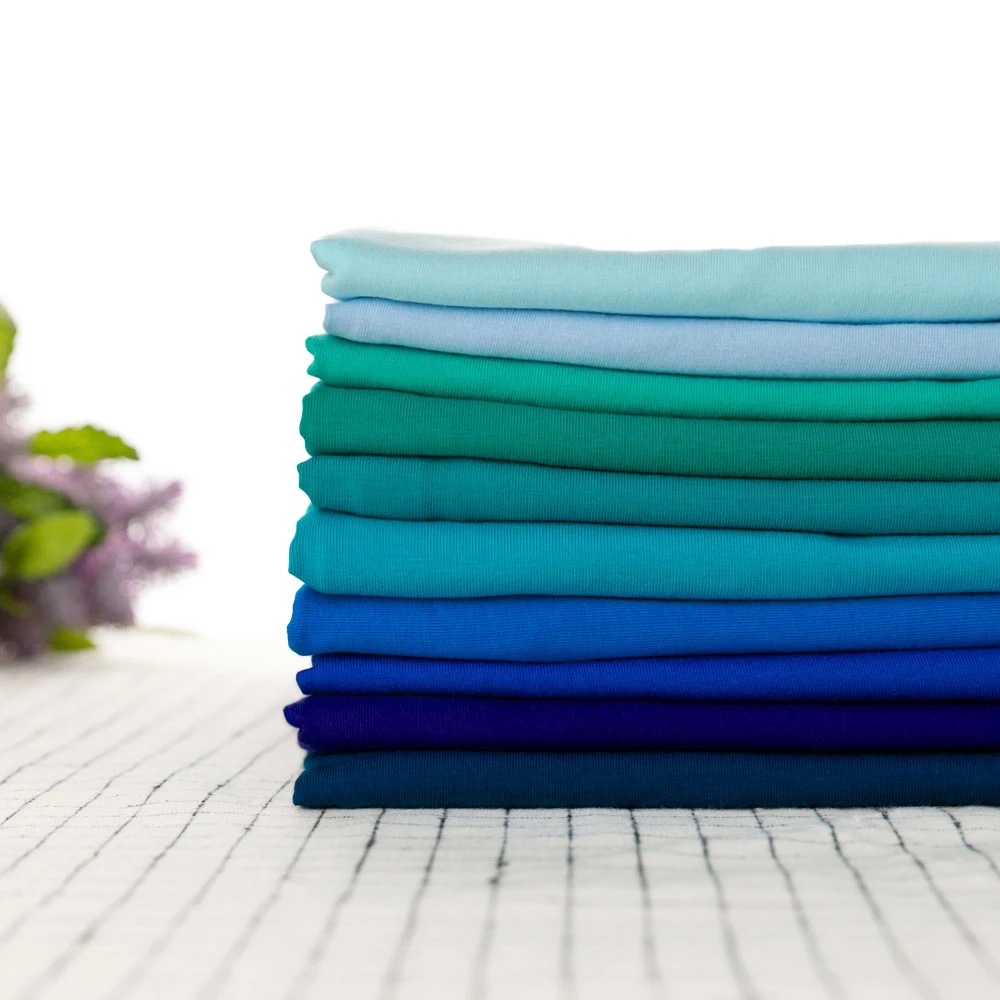 
In Stock blue solid color CPSIA approved 95% cotton 5% lycra stretch single jersey fabric 