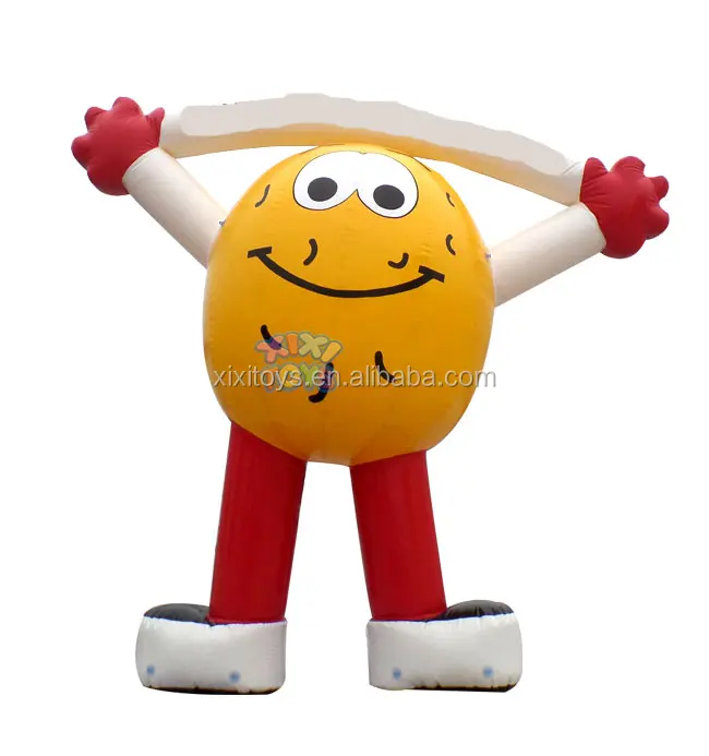 Large inflatable strawberry balloon on ground, advertising fruit inflatable character cartoon