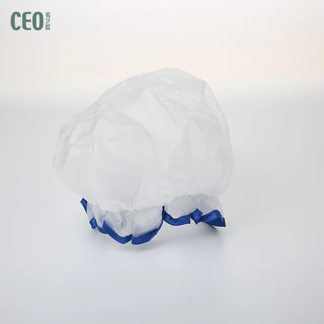 White oversize disposable shower cap with blue and red brim