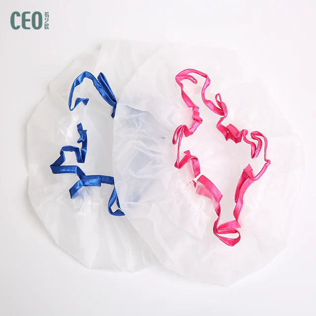 White oversize disposable shower cap with blue and red brim