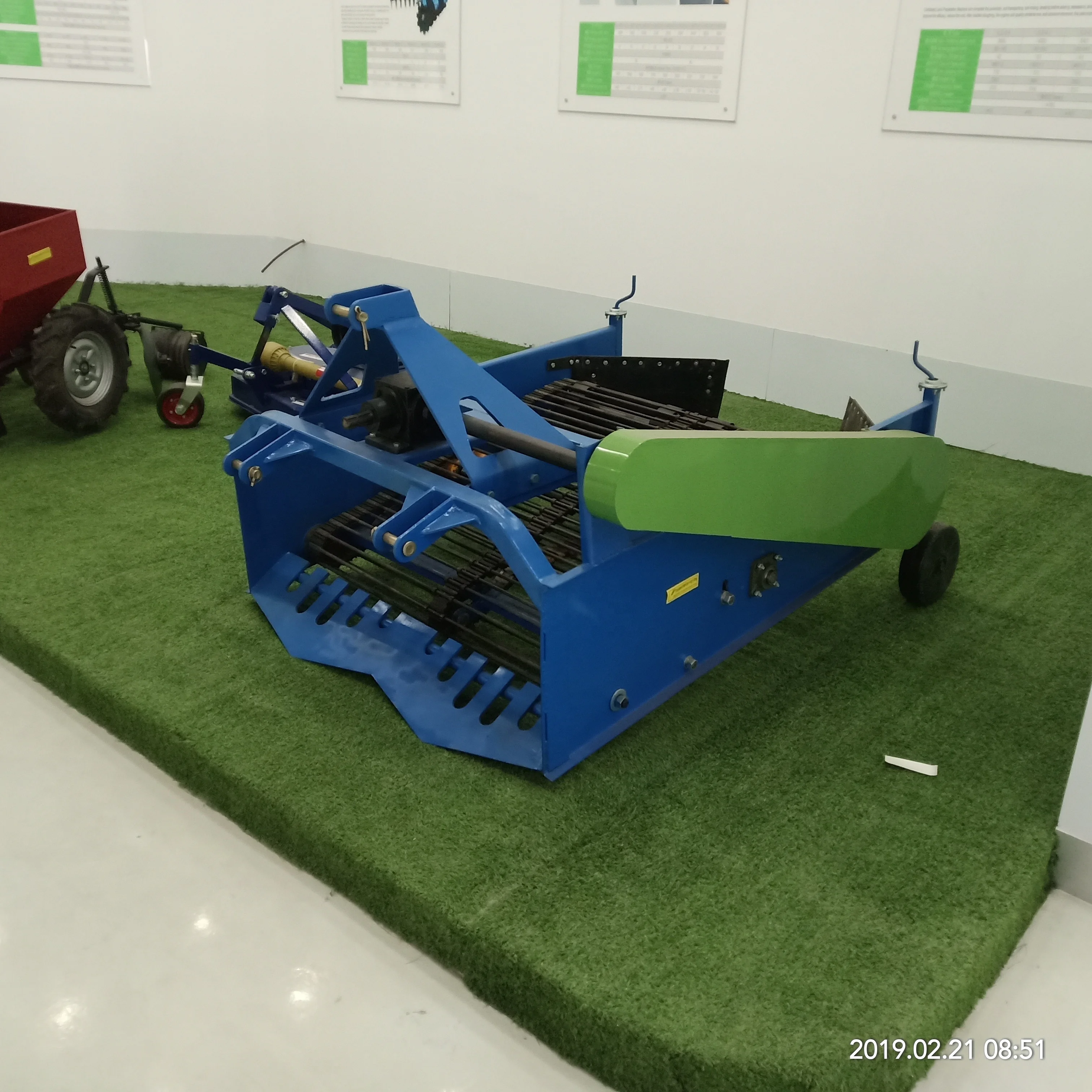 
walking tractor supporting potato harvester 