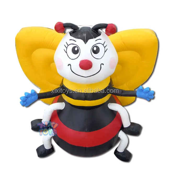 Large inflatable strawberry balloon on ground, advertising fruit inflatable character cartoon