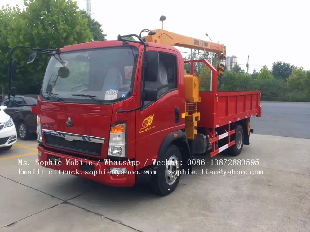 sinotruck RHD howo dump truck with crane 6 wheel dump truck load volume capacity for sale in dubai
