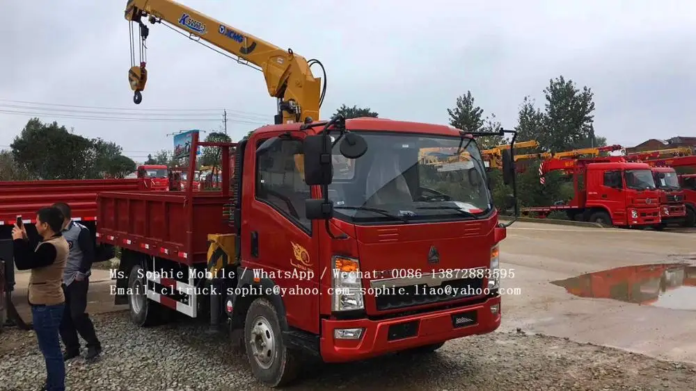 sinotruck RHD howo dump truck with crane 6 wheel dump truck load volume capacity for sale in dubai