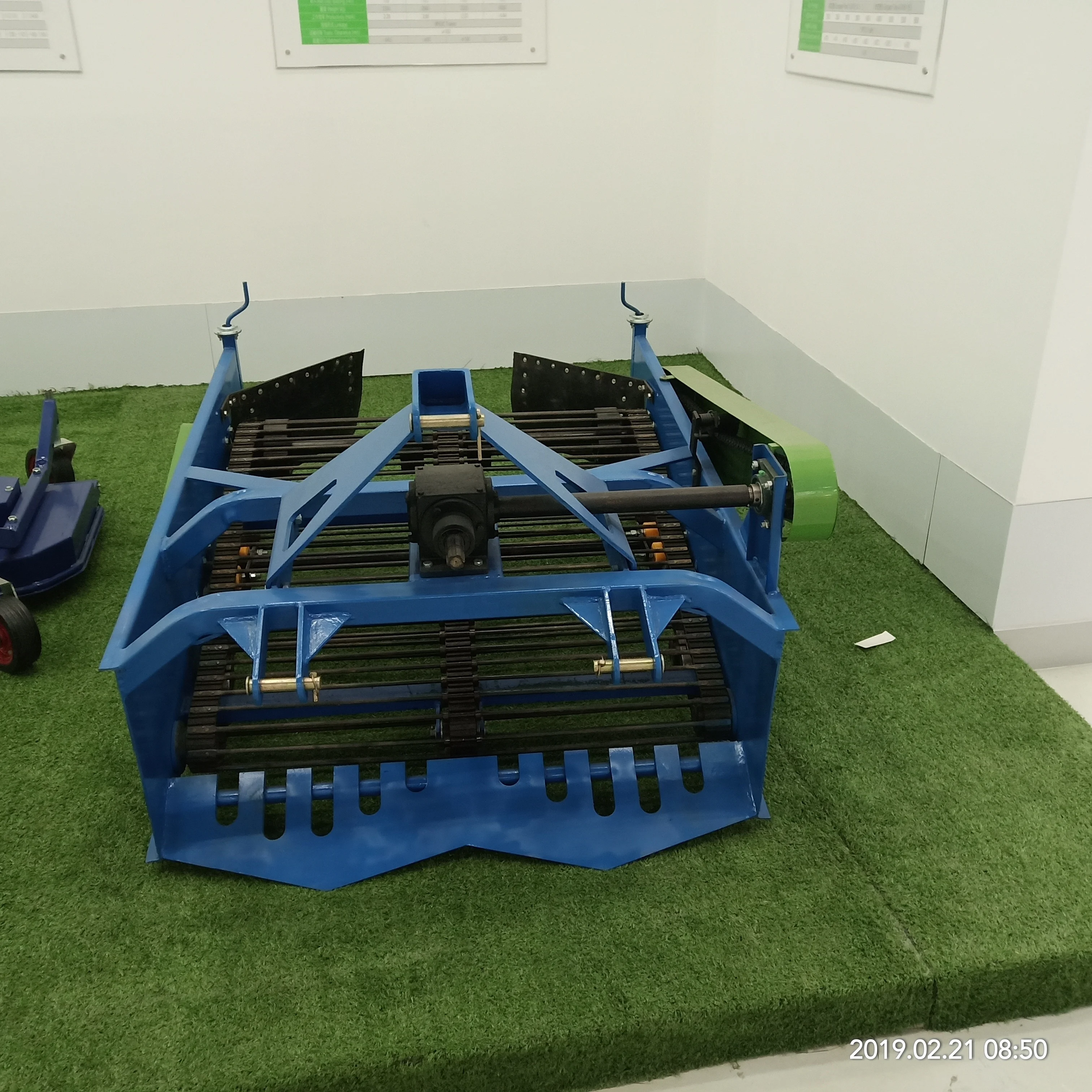 
walking tractor supporting potato harvester 