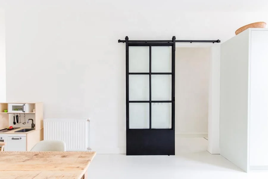 
French Style Black Carbon Steel Sliding Frosted Glass Black Frame Barn Door with Soft Close 
