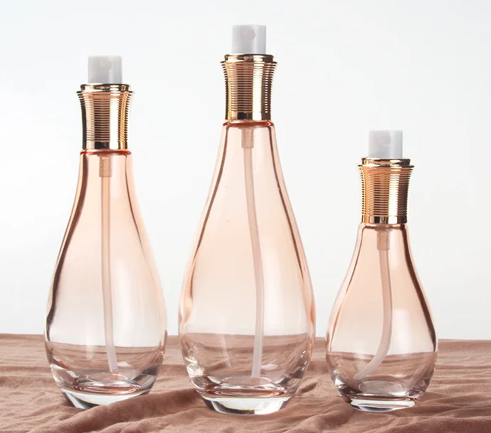 High end free sample 60ml 100ml 150ml bowling ball shape glass lotion bottle with gold pump for body face lotion