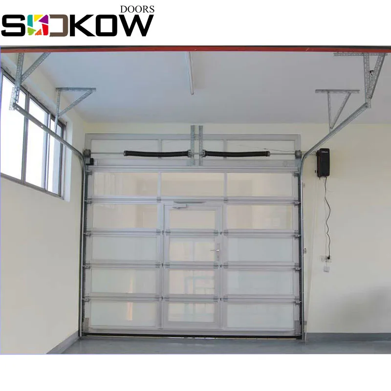 glass sectional door with pesdestrain door