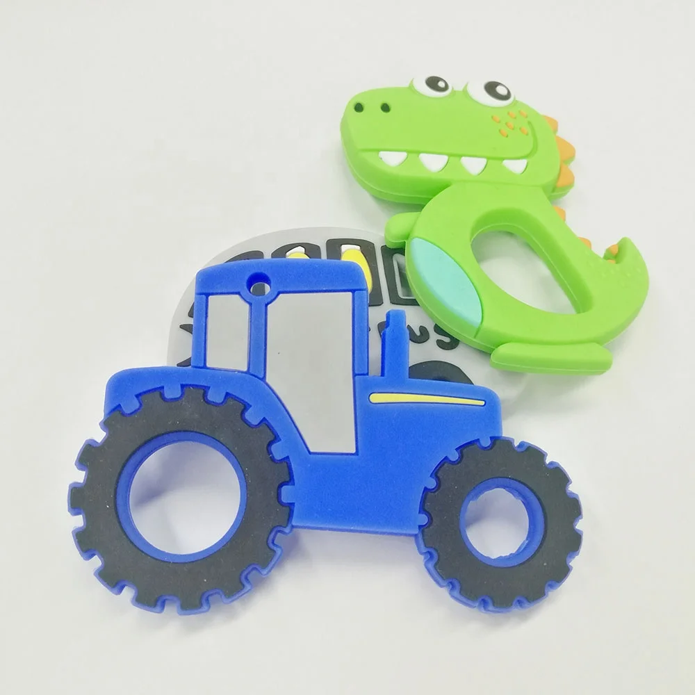 Wholesale customized colorful dinosaur food grade silicone teether child baby chew teething ring toys