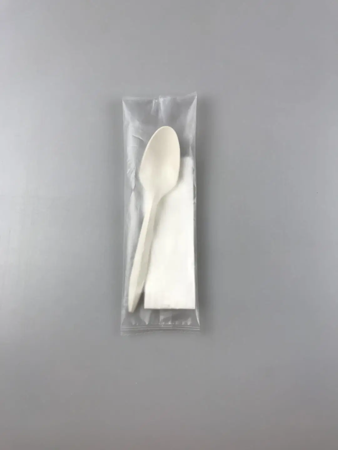 Spoon separately wrapped plastic wrapped spoon plastic spoon with napkins wrapped