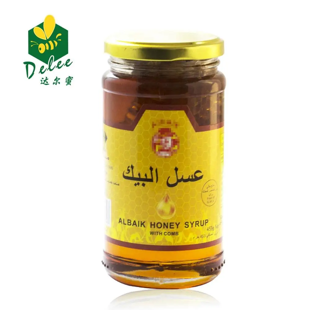 raw honeycomb with glass bottle for honey packing