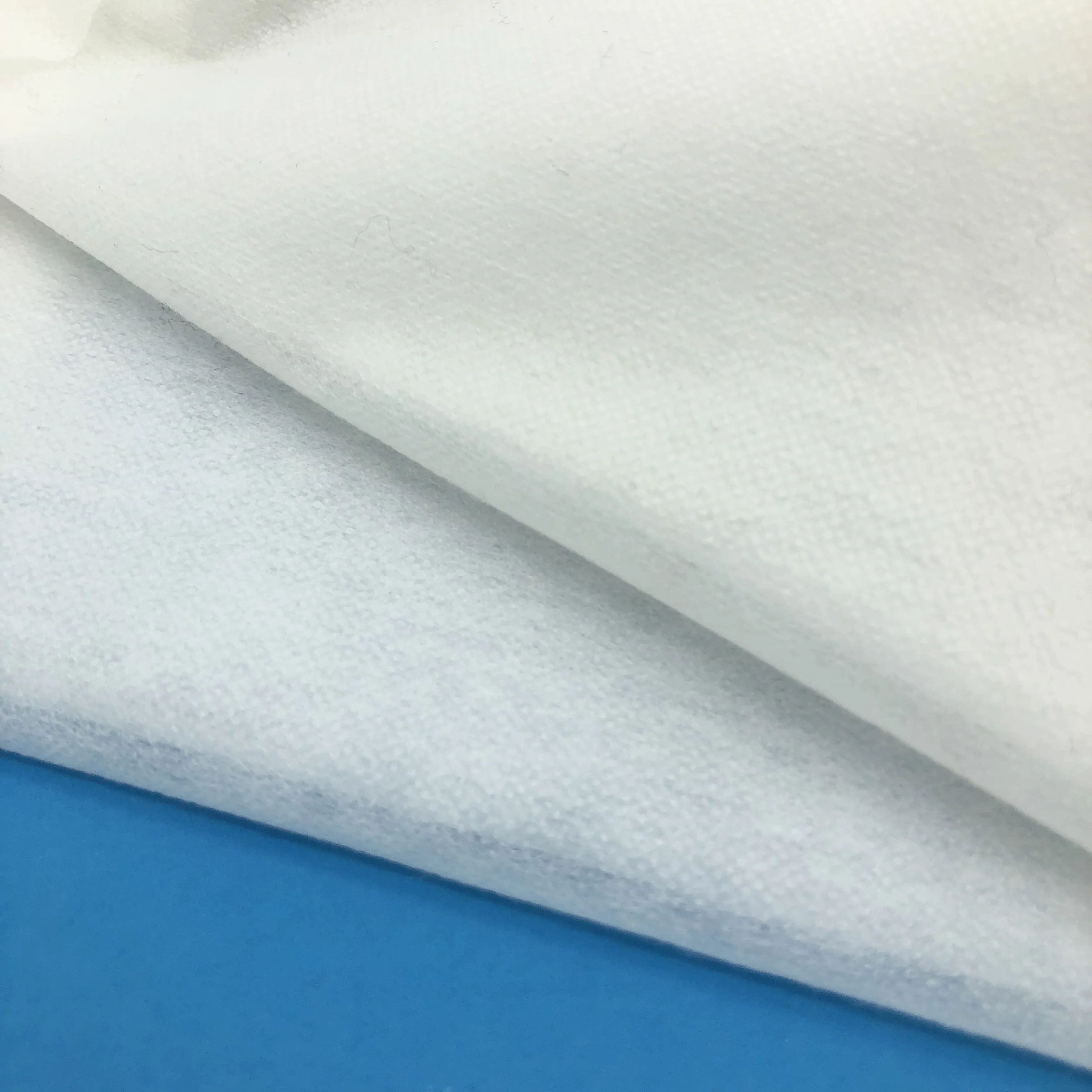 
100 polyester nonwoven fusible hot rolling interlining for apparel 
