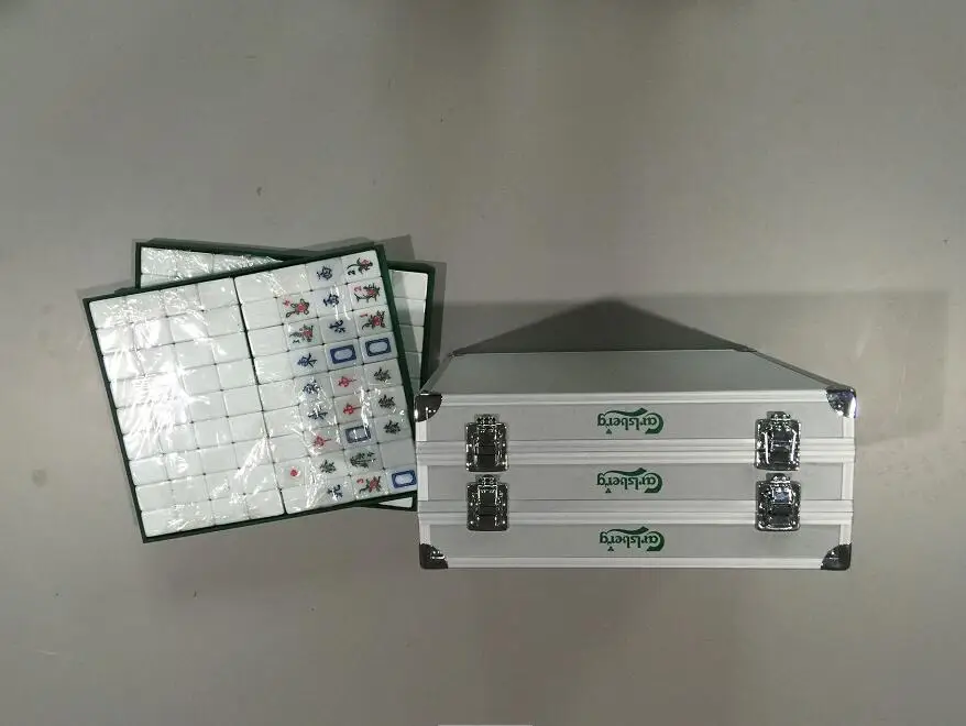 
double aluminum storage case with mahjong in it 
