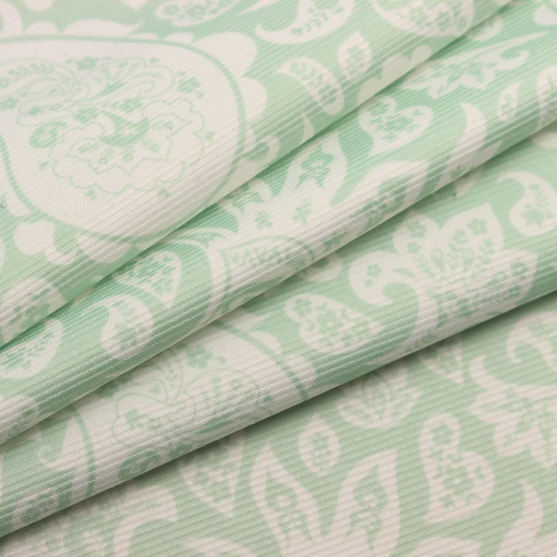 
Cordury fabric with green pattern printing 