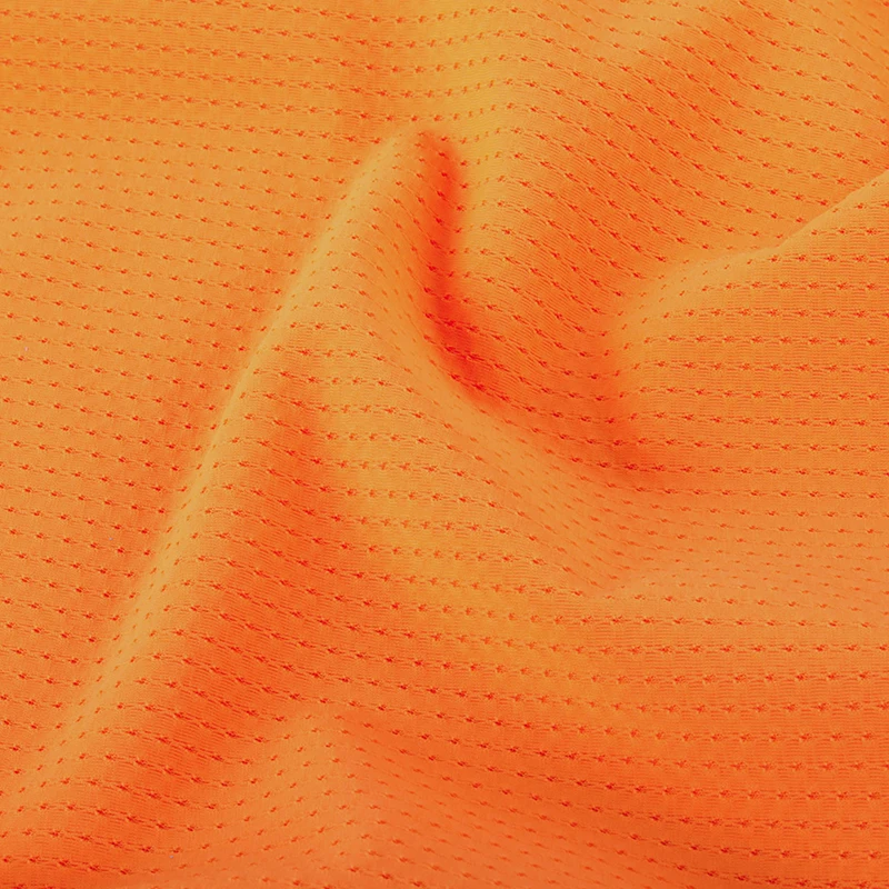 Wholesale 80 nylon 20 spandex orange soft 4 way stretch close hole lace mesh fabric for garment sportswear