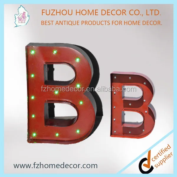 Decorative standing metal letters with lighted H letter
