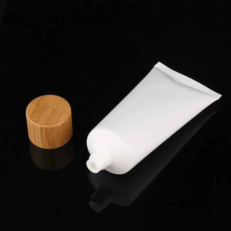 Empty cosmetic plastic soft squeeze tube with bamboo lid cleanser toothpaste container packaging