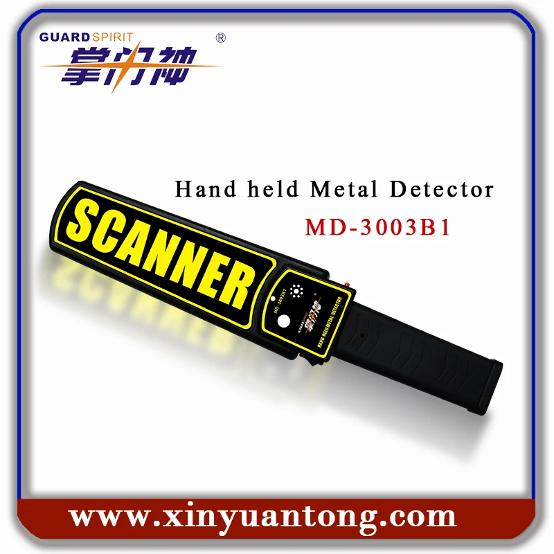 
security guard hand holding mini metal detector for public safety checking 
