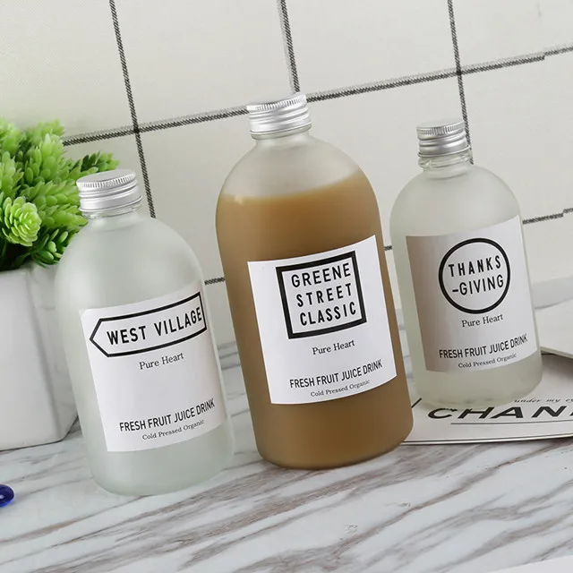 new design wholesale price available different sizes frosted and clear glass juice bottle