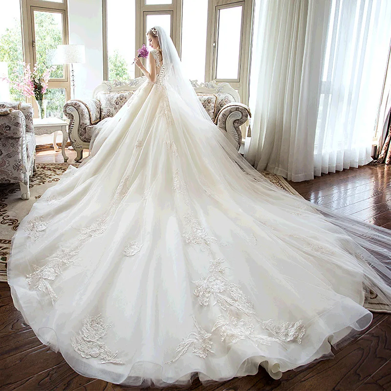 Wholesale sleeveless  flower lace wedding bridal dresses 2019 with long tailing Temperament Wedding Dress