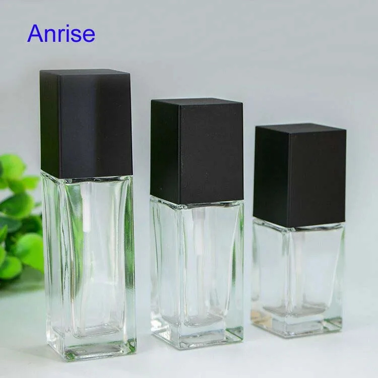 Distinctuve 30ml 50ml Square Clear Glass Cosmetic Essence Bottle Refillable Serum Squeeze Spray Bottle with Black Cube Cap