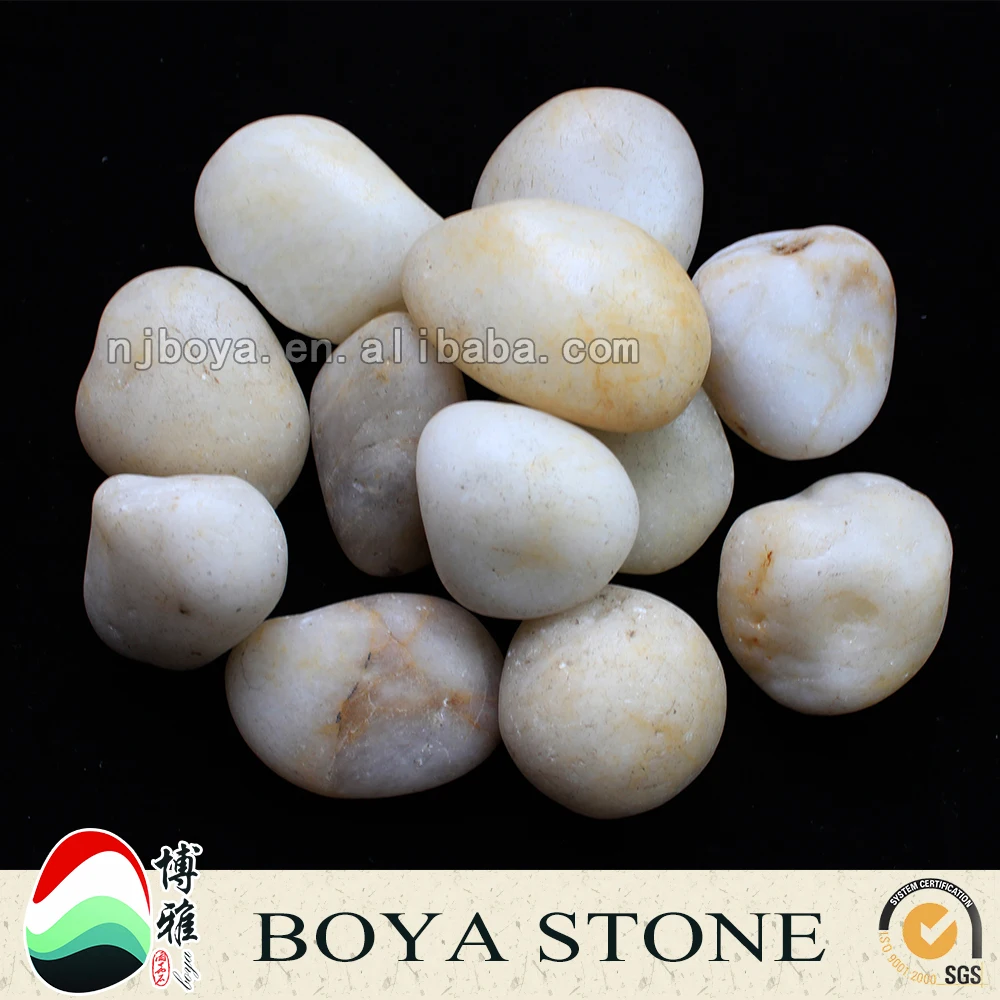 
snowy white polished pebble stones, pebbles, cobbles for landscaping and garden 