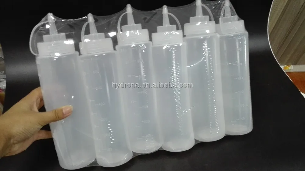 Clear plastic squeeze sauce bottle with shrink wrapping