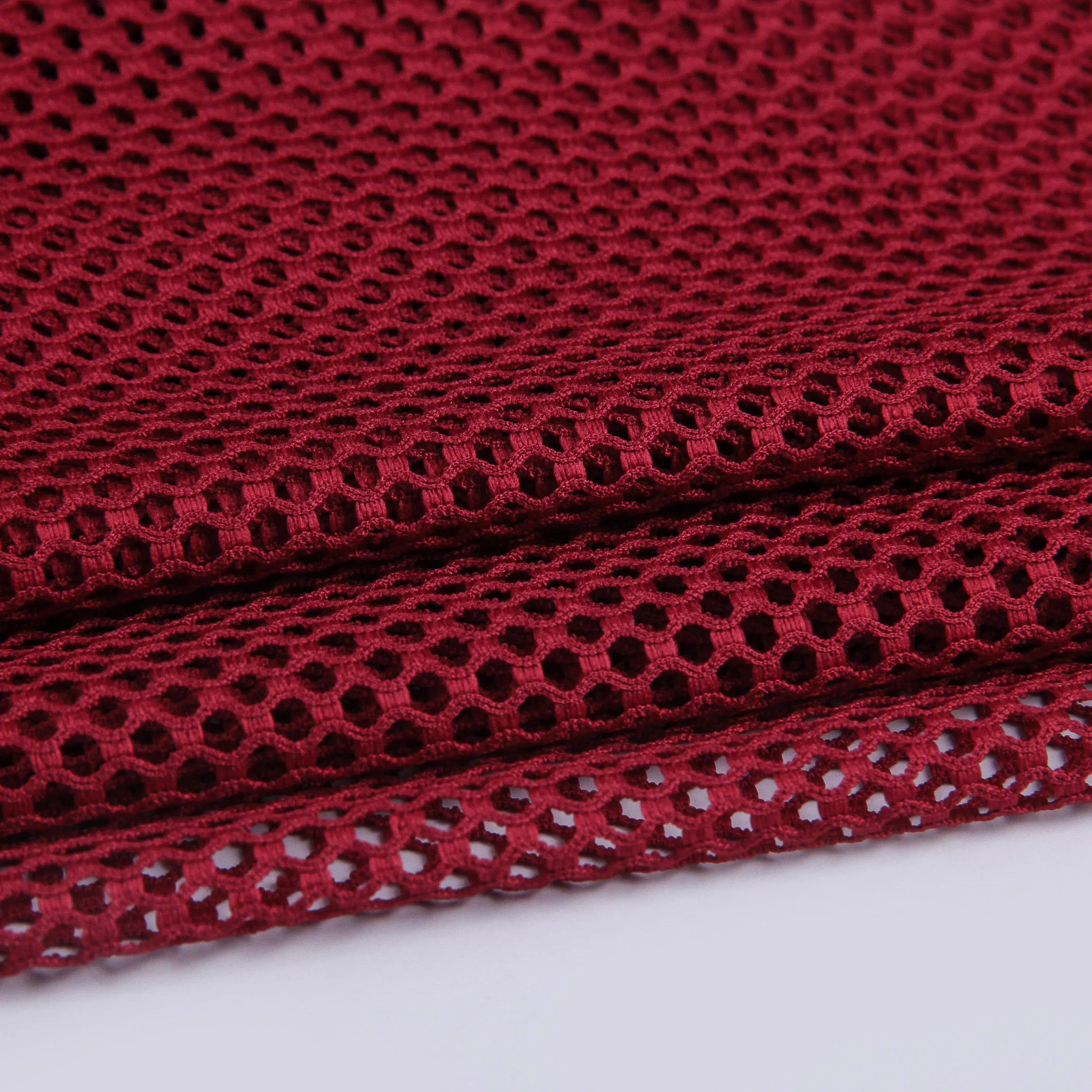 warp knitting raschel elastic polyester mesh fabric for swimsuit