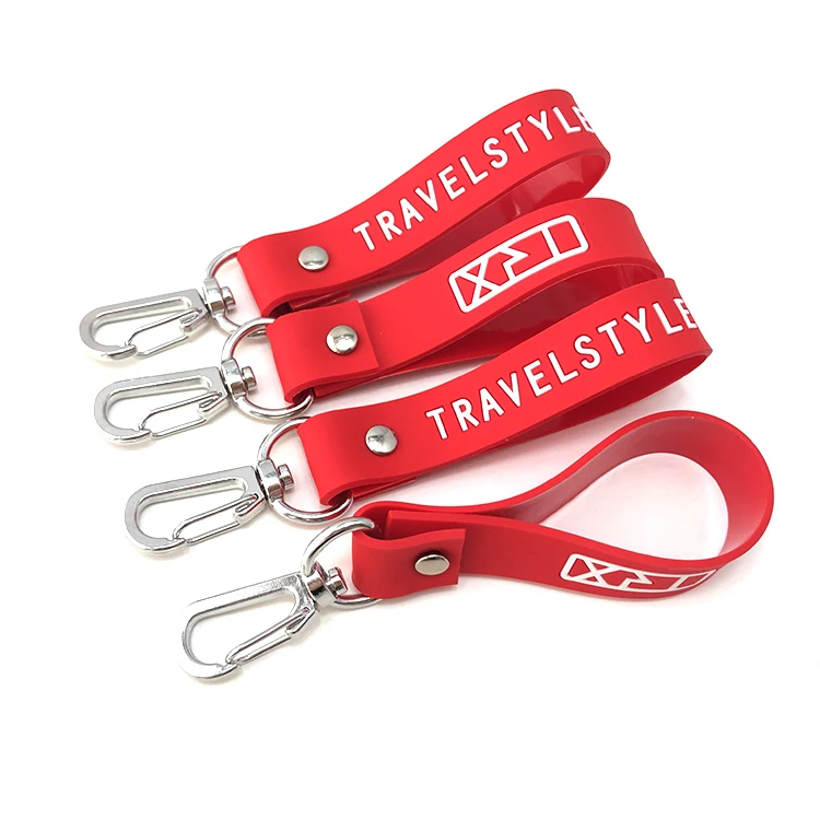 Hot sale black color tape and engraved logo 100% soft silicone wristband key chain