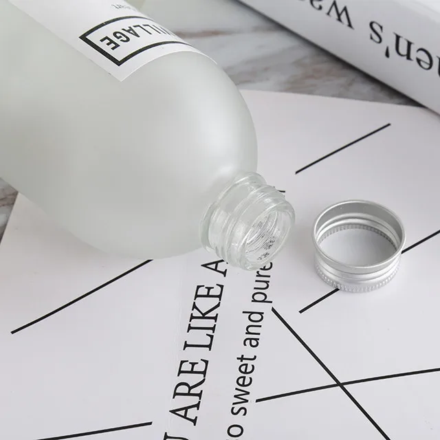 new design wholesale price available different sizes frosted and clear glass juice bottle