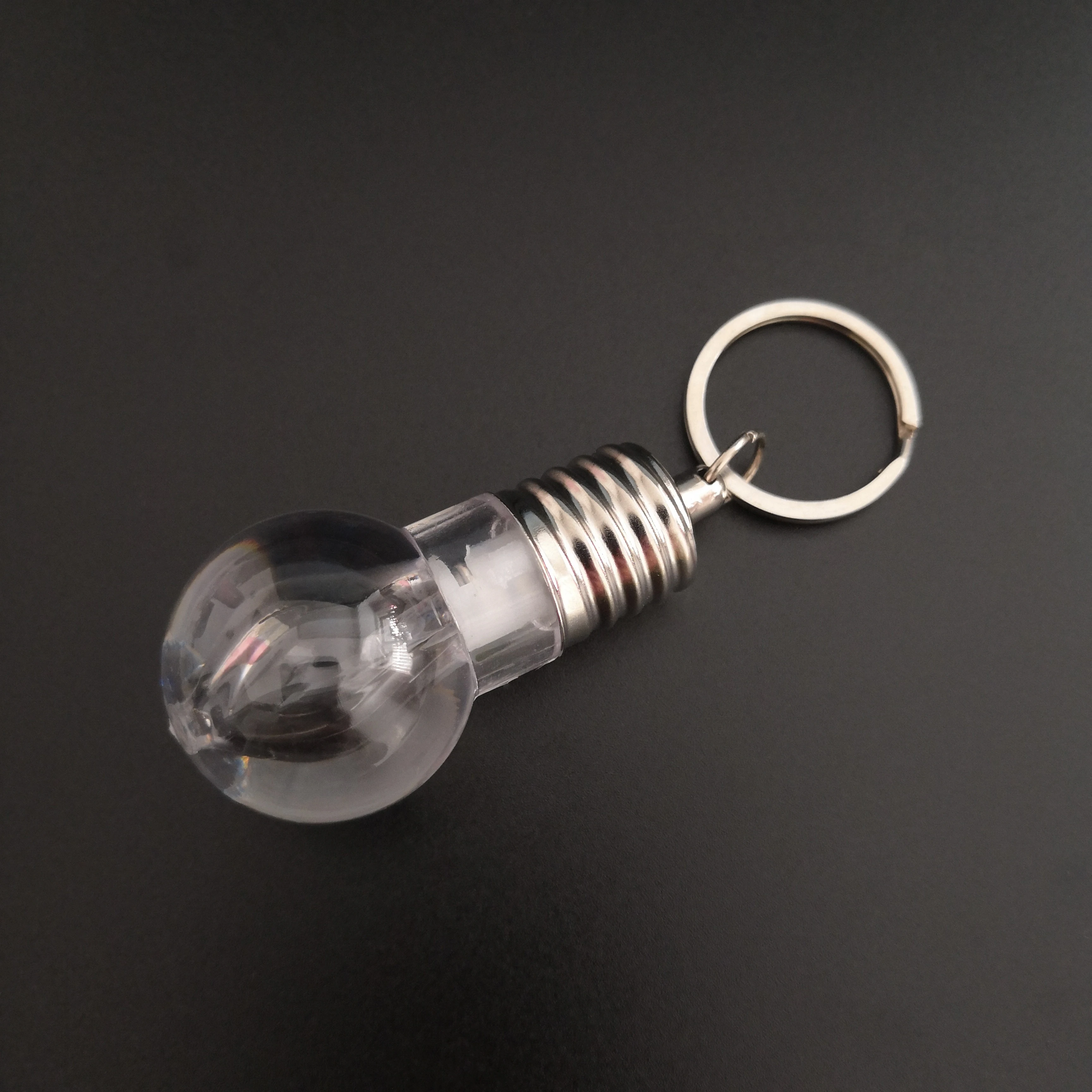 
Custom Logo Souvenir Plastic Mini Colorful Led Light Bulb Ring Keychain Cute Accesory Lovely Light Lamp Key Chain 