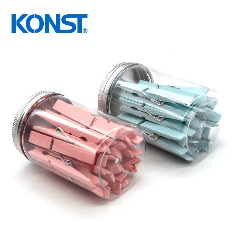 Pink wood clothes peg in plastic jar for office