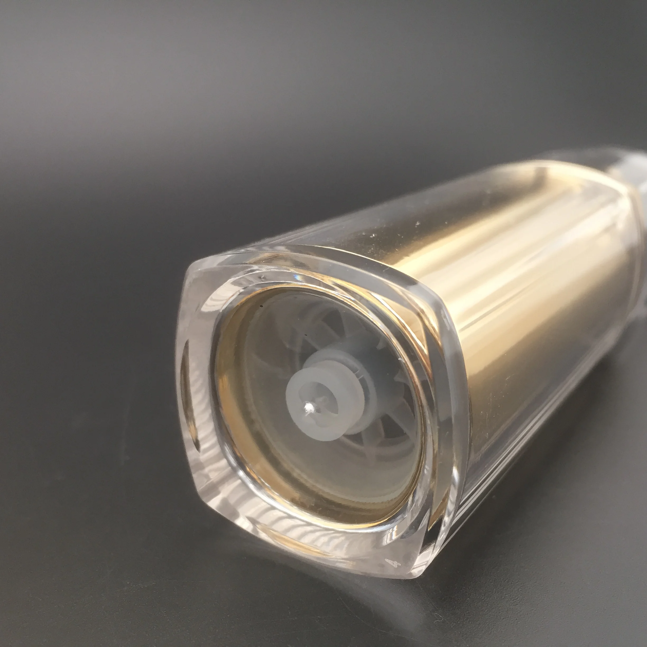 
UV coated gold acrylic airless serum bottle for rectangle shape 