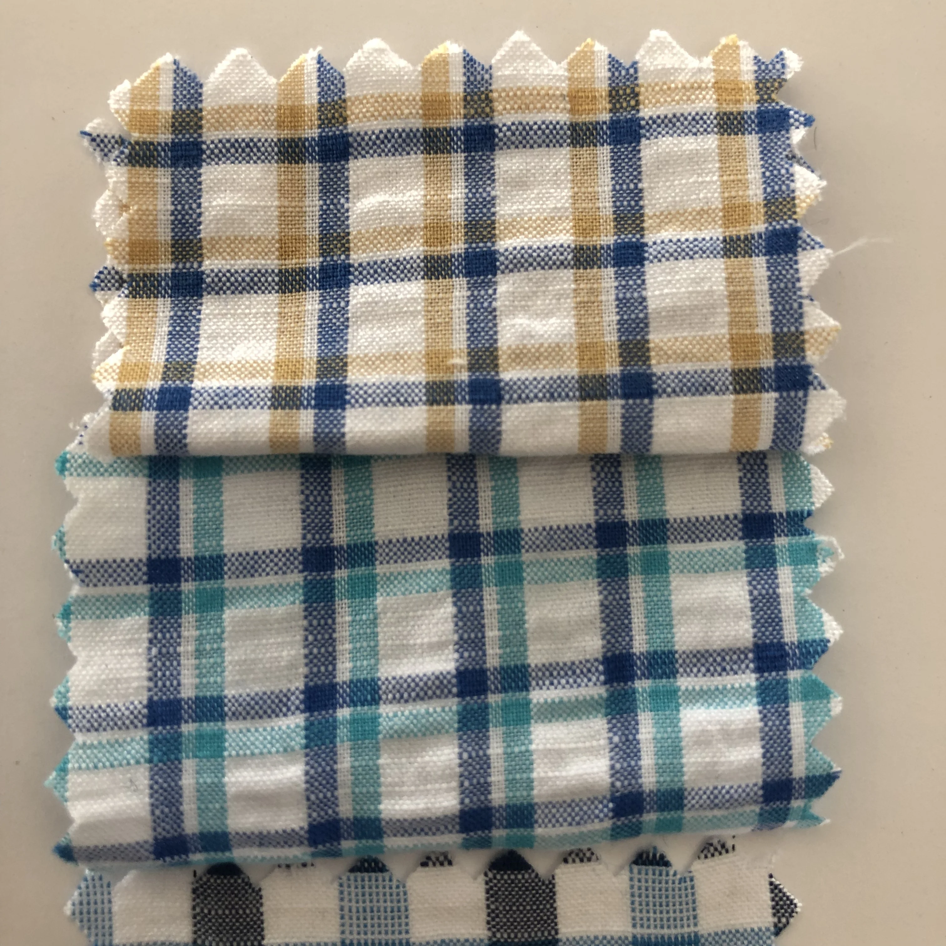 
cheap factory directly support fashion 100% cotton woven plaid check seersucker shirt cloth fabric 