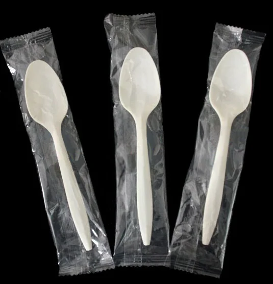Spoon separately wrapped plastic wrapped spoon plastic spoon with napkins wrapped