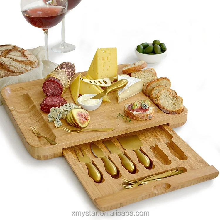 
bamboo cheese serving cutting board wooden, multipurpose servinf tray with a set of 6 cutleries in a slide-out drawer perfect fo 